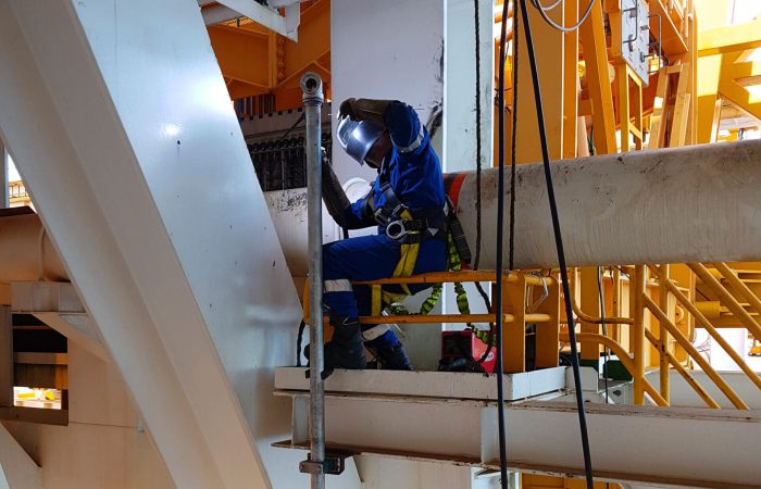 Welder Professional working at height