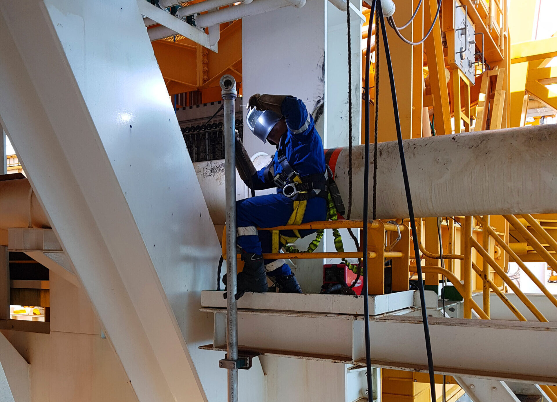 Welder Professional working at height
