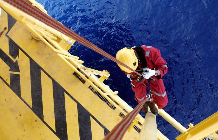 Offshore Worker Using Rope Access of Piping Inspection.