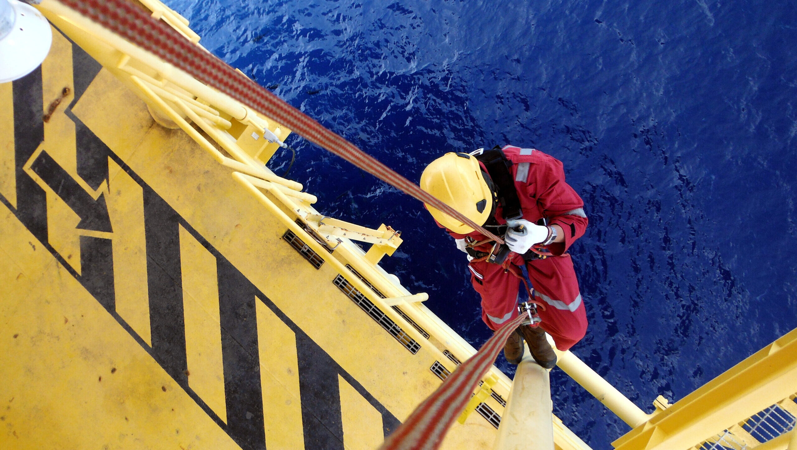 Offshore Worker Using Rope Access of Piping Inspection.